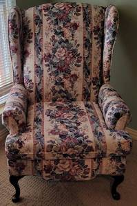 lot 225 image: UPHOLSTERED ACCENT CHAIR WITH WOODEN FRAME IN STYLE, COLOR, AND CONDITION SHOWN.
