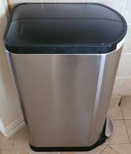 lot 284 image: STAINLESS STEEL TRASH CAN WITH PLASTIC ACCENTS IN STYLE, COLOR, AND CONDITION SHOWN.