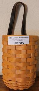 lot 315 image: LONGABERGER COLLECTORS CLUB 2002 EDITION TALL BASKET IN STYLE, COLOR, AND CONDITION SHOWN.