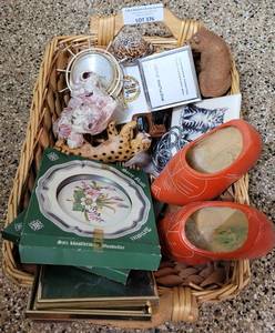 lot 376 image: WOVEN STYLE BASKET WITH ASSORTED HOME DECOR AS SHOWN.