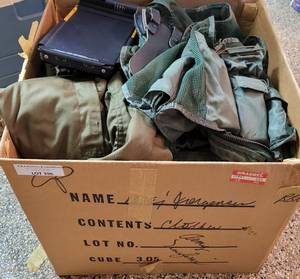 lot 396 image: BOX LOT OF MILITARY  ARMY UNIFORMS INCLUDING SURVIVAL VEST WITH SOME ACCESSORIES. LOT INCLUDES PANTS, SHIRTS, AND MORE.