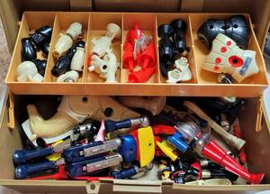 lot 397 image: VINTAGE MADE IN JAPAN TRANSFORMERS-STYLE TOYS WITH PARTS AND ACCESSORIES AS SHOWN.