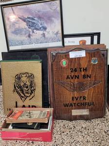 lot 410 image: MILITARY INSIGNIA, THEMED FRAMES, VINTAGE YEARBOOKS, AND MORE AS SHOWN.