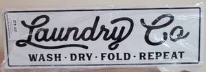 lot 412 image: LAUNDRY CO. METAL WALL SIGN AS SHOWN.