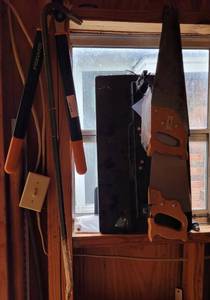 lot 426 image: LOT OF HAND HELD SAWS, FISKARS PRUNERS, CROW BAR, AND T.V. MOUNT AS SHOWN.