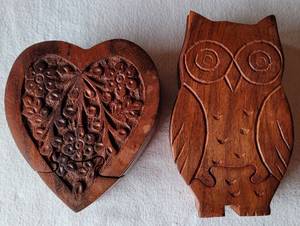 lot 193 image: (2) ARTISAN CRAFTED TEAK WOOD PUZZLE BOXES IN HEART (4.5 X 4) AND OWL SHAPES.