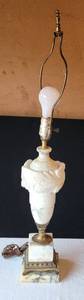 lot 207 image: CARVED ITALIAN TRVARTINE MARBLE STACK LAMP WITH SHADE. BODY ENCIRCLED WITH CARVED ACANTHUS LEAVES 31H POWERS ON AND SWITCH WORKS.
