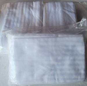 lot 220 image: KING SIZE WHITE HIGH THREAD COUNT 60% ORGANIC REGENERATED COTTON 40% POLY SATEEN DOBBY STRIPE PILLOWCASES. 40L x 20W 12 PER PACK (YOUR BID X 3)