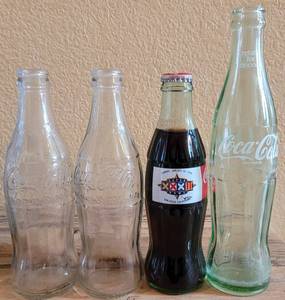 lot 247 image: LOT OF 4 COCA-COLA COLLECTIBLE BOTTLES AS SHOWN.