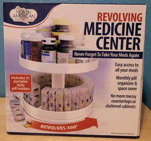 lot 25 image: North America Health  Wellness White Revolving Medicine Center in new condition as shown.