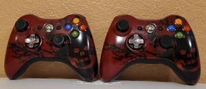 lot 45 image: Lot of 2 Wireless Xbox Controllers as shown.