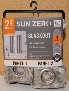 lot 63 image: Sun Zero Blackout Curtains in unopened package as shown. 2-pack Approx. 63 in length.