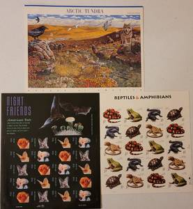 lot 92 image: LOT OF 3 UNUSED SHEETS OF COLLECTIBLE STAMPS FROM EARLY 2000S AS SHOWN. NIGHT FRIENDS, REPTILES & AMPHIBIANS, AND ARCTIC TUNDRA. (YOUR BID X 3)