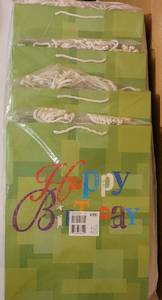 lot 95 image: LOT OF 4 PACKS OF LARGE SIZE BIRTHDAY GIFT BAGS IN STYLE SHOWN. EACH PACK CONTAINS 6 BAGS. (YOUR BID X 4)