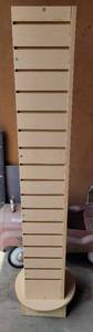 lot 134 image: TALL ROTATING COMMERCIAL PEG SLOT SHELF DISPLAY UNIT AS SHOWN. APPROX. 14 W x 61 H.