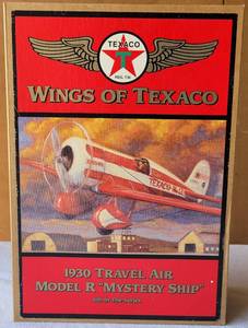 lot 156 image: 1997 WINGS OF TEXACO 1930 TRAVEL AIR MODEL R MYSTERY SHIP DIE CAST METAL COIN BANK IN ORIGINAL BOX AS SHOWN.