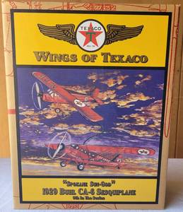 lot 159 image: 2001 WINGS OF TEXACO 1929 SPOKANE SUN-GOD BUHL CA-6 SESQUIPLANE DIE CAST METAL COIN BANK IN ORIGINAL BOX AS SHOWN.