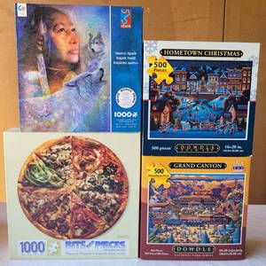 lot 165 image: LOT OF 4 PUZZLES IN VARIOUS THEMES AND SIZES AS SHOWN.