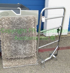 lot 107 image: Electric towel warmer and bath rug set (never used)