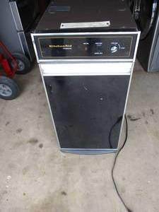 lot 23 image: Built In,  Kitchen Aid Trash Compactor, Model KUCC150S1