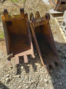 lot 17 image: 2 Backhoe Claw Attachments 1 is 12 wide, 1 is 18wide