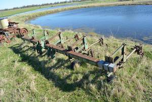 lot 27 image: 5 row Cultivator, looks to be a John Deere
