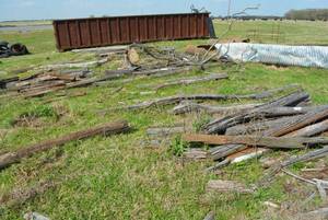 lot 174 image: Used Wood Fencing Posts, some with metal sleeves