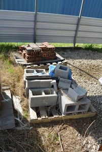 lot 18 image: Misc. Cinder Blocks as shown and Small Pallet of Bricks