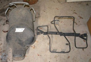lot 79 image: Vintage Motorcycle Seat  no markings  and 4 Wheeler above wheel rack Mounts