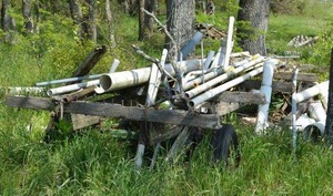 lot 30 image: Green Trailer Frame (Under PVC)  7Ft. X 12Ft. 4 Wheel metal Frame