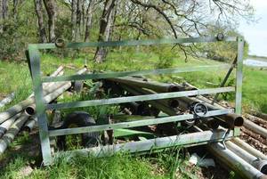 lot 202 image: John Deere Trailer Frame (Under Irrigation Pipes) 8Ft. X 16Ft. Green 4 Wheel Frame with Front Guard 8 x 51