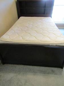 lot 101 image: Coaster company twin bed headboard with 6 cubbies 4 drawers on side 2 cubbies 1 door