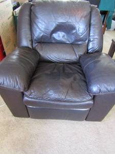 lot 137 image: Ashley Furniture Company brown leather pillow back rocking recliner