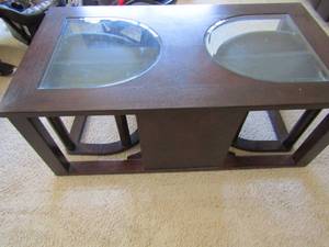 lot 138 image: Ashley coffee table with divided glass top and stow and go incorporated seats