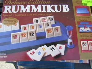lot 142 image: Game lot - Rummikub, Scrabble, Trivial Pursuit
