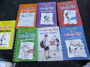 lot 154 image: Red crate with 7 Diary Of A Wimpy Kid books