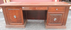 lot 34 image: Contemporary executive desk with sliding cabinet inserts and incorporated electric switches  controls 8 x 4