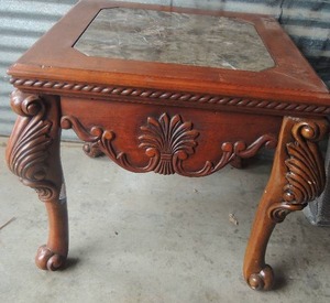 lot 7 image: Vintage carved table with octagon shaped Leopard marble inset top and carved apron and legs.