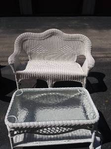 lot 42 image: Glass top white wicker patio table 18x33x19 and love seat35x52x25