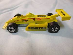 lot 44 image: Hot Wheels 1982, Indy Race Car #4 Yellow Diecast Car, Malaysia