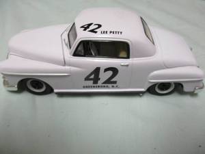lot 102 image: Racing Champions-50th Anniversary, 124 Scale,1949 Plymouth Deluxe, #42-Lee Petty, Greensboro, N.C, Stock Car, Diecast Car.