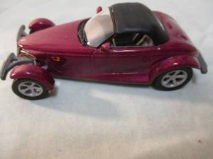 lot 210 image: UNIVERSAL HOBBIES, 143 scale, Plymouth Prowler, Diecast Car.