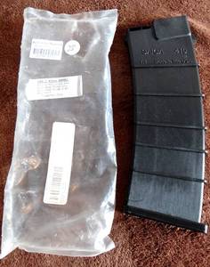 lot 28 image: SAIGA 410ga 15 round magazine by SURE FIRE GUN MAGS - UNUSED