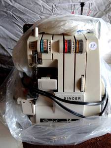 lot 37 image: Singer 14U64A Ultralock Portable Serger Sewing Machine with Foot Pedal - Appears Complete with Manual