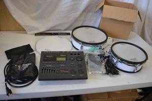 lot 12 image: Electric Drums PD-100 and PD-120 by Roland, Mesh Head for PD-120 unopened and Sound Module