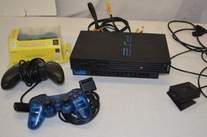 lot 21 image: PlayStation 2, 3 Controllers ( 1 is Unopened) and 1 Eye Toy