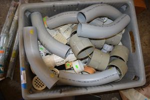 lot 100 image: Plumbing Pieces 2.5 to 5 and floor drain caps