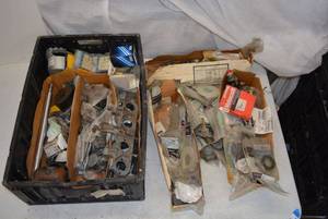 lot 108 image: Large amount of Automotive parts many different years and makes and parts including Muffler Clamp, electrical parts, gaskets and More