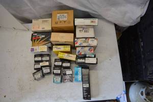 lot 109 image: Carburetor Repair Kit, Receiver Drier and Headlamps, Dorman and Edelmann Replacement Parts