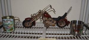 lot 167 image: Motorcycle Dcor Piece and Chuck Wagon Soda Tin Cups